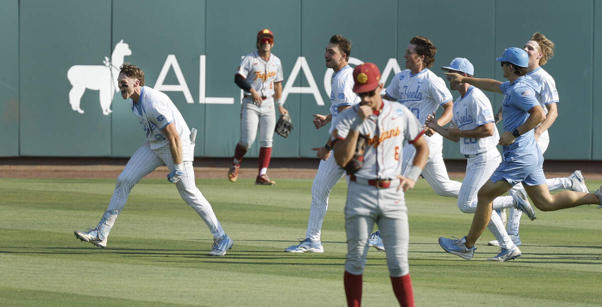 North Carolina's Owen Hull (8) and the team celebrate after Hull made the winning hit in UNC’s 4-3 victory over USC at Boshamer Stadium to win the Chapel Hill Super Regional Sunday, June 7, 2026.