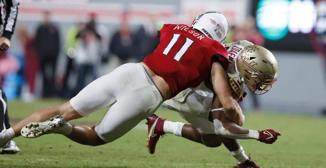 N.C. State linebacker Payton Wilson (11) tackles Florida State running back Lawrance Toafili (9) during the second half of N.C. State’s 19-17 victory over Florida State at Carter-Finley Stadium in Raleigh, N.C., Saturday, Oct. 8, 2022.