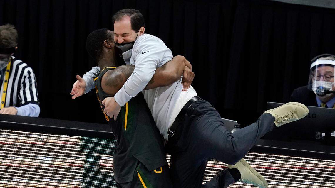 Baylor head coach Scott Drew gets a hug from guard Mark Vital at the end of the championship game against Gonzaga in the NCAA basketball tournament, Monday, April 5, 2021, at Lucas Oil Stadium in Indianapolis. Baylor won 86-70.