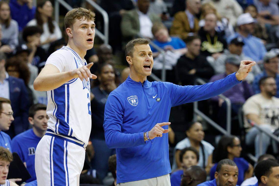 Duke’s Cooper Flagg (2) and head coach Jon Scheyer instructs the team during the first half of Duke’s game against Alabama in their Elite 8 game in the 2025 NCAA Men’s Basketball Championship at the Prudential Center in Newark, N.J., Saturday, March 29, 2025.