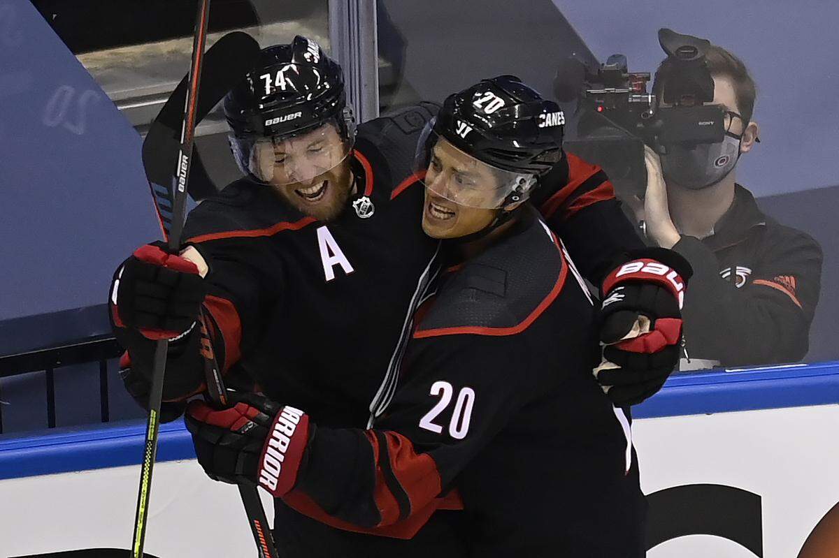 Carolina Hurricanes defenceman Jaccob Slavin (74) celebrates his goal against the New York Rangers with teammate Sebastian Aho (20) during the first period in the NHL hockey Stanley Cup playoffs in Toronto, Saturday, Aug. 1, 2020.