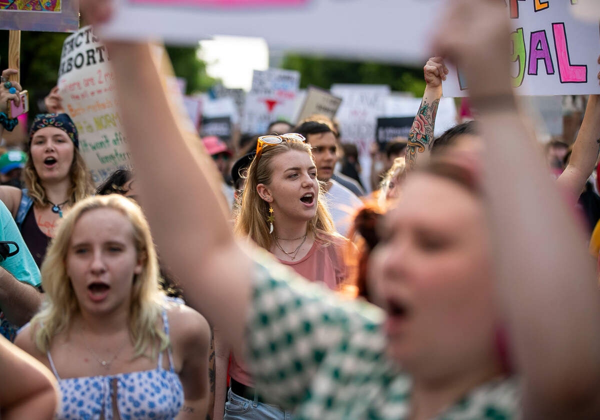 Demonstrators pause to chant their demands on Morgan Street at the State Capital during a rally and march to preserve abortion rights on Tuesday, May 3, 2022 in Raleigh, N.C.