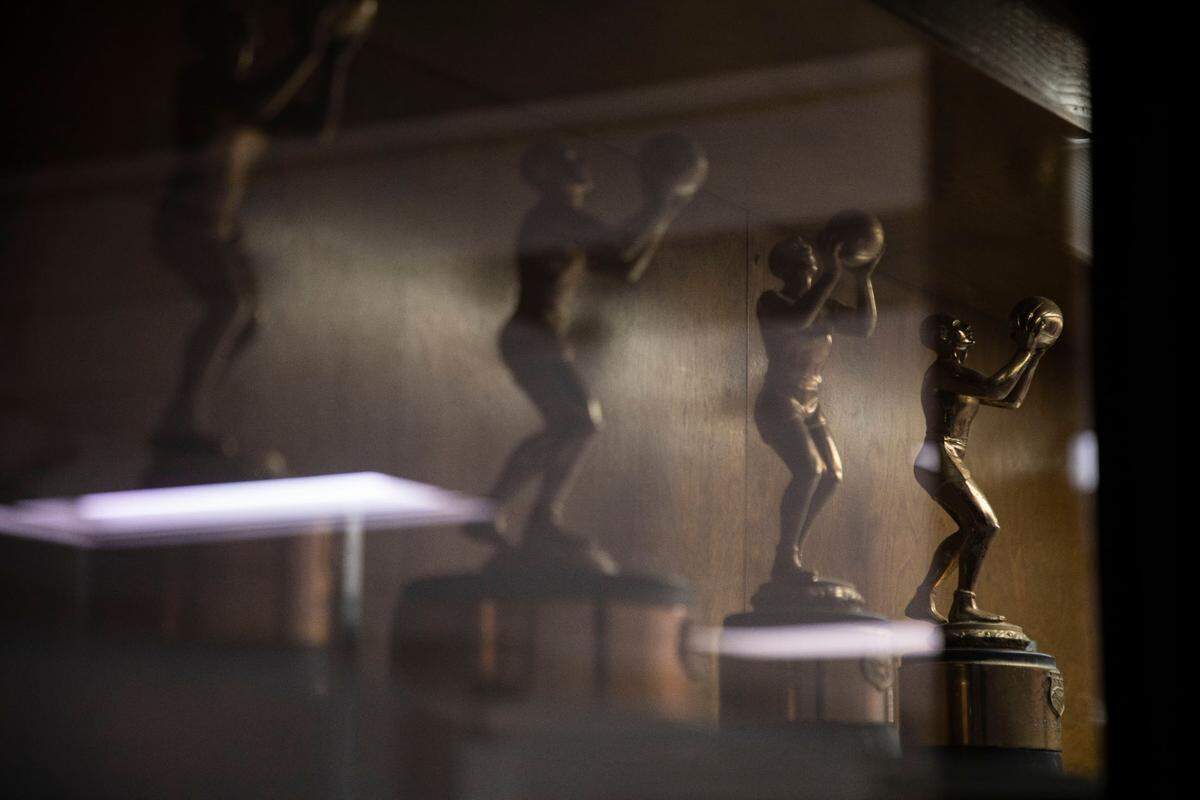 Trophies fill display cases in the halls outside of the basketball gym at Kinston High School, pictured here on Jan. 10, 2022.