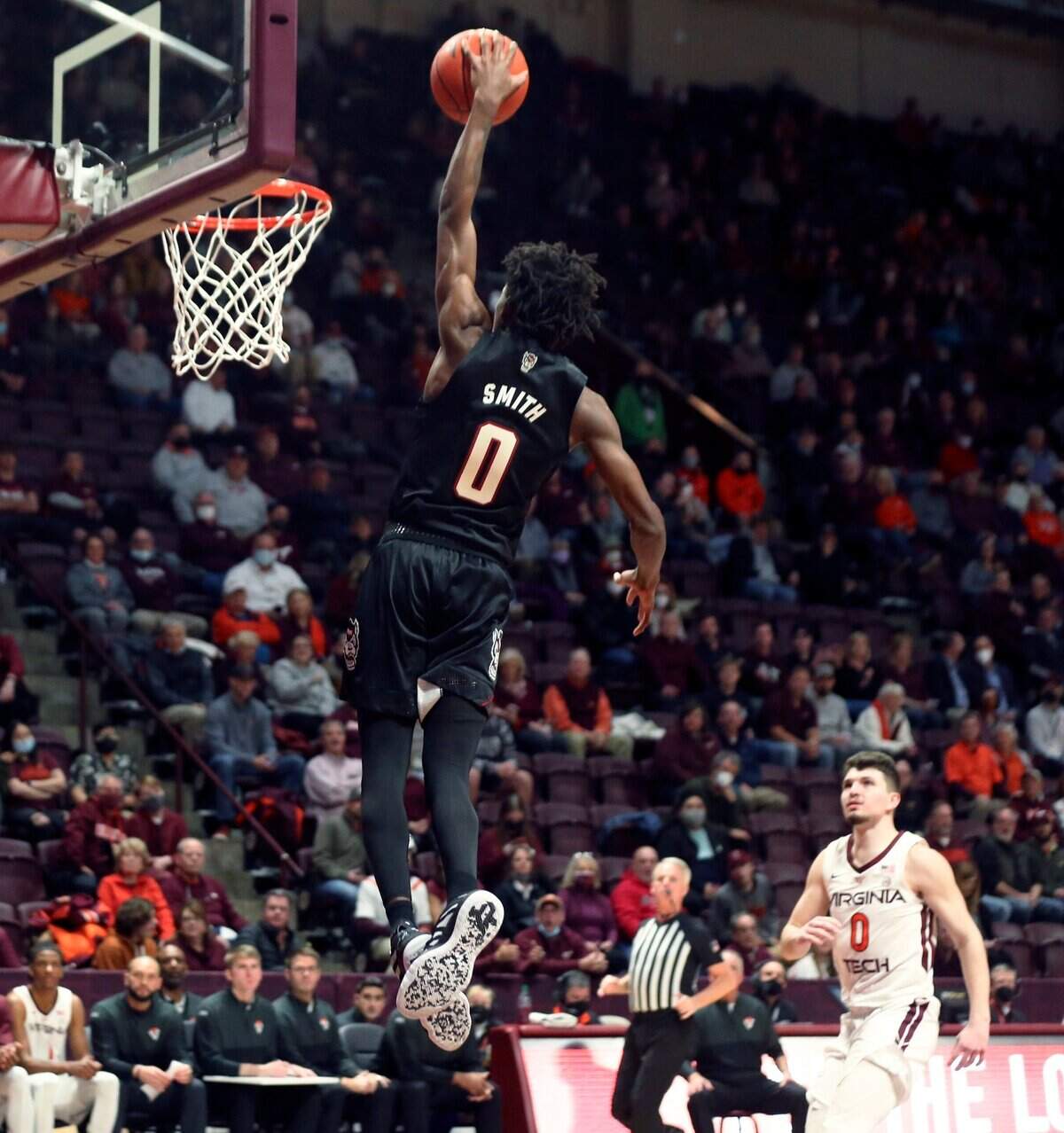 North Carolina State’s Terquavion Smith (0) scores against Virginia Tech during the first half of an NCAA college basketball game Tuesday, Jan. 4, 2022, in Blacksburg, Va. (Matt Gentry/The Roanoke Times via AP)