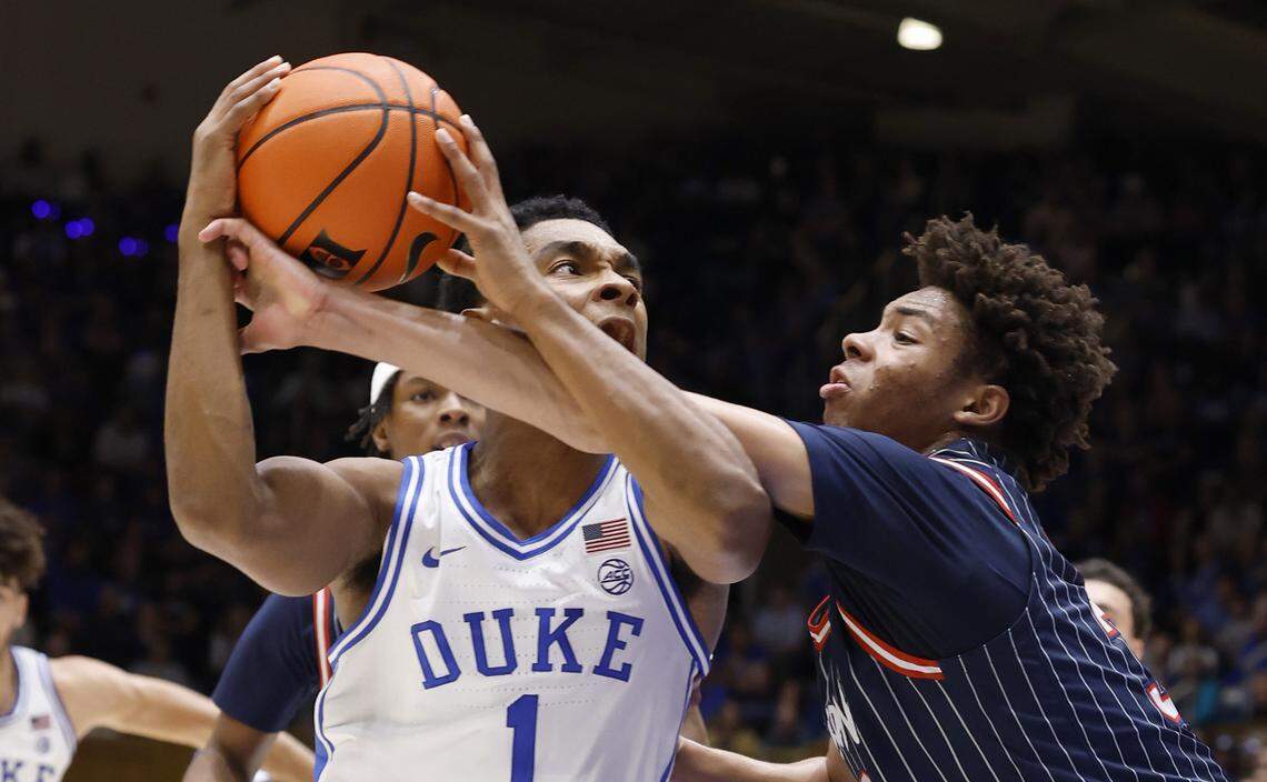 Duke’s Caleb Foster (1) is fouled by Howard's Travelle Bryson (32) during the first half of Duke’s game against Howard at Cameron Indoor Stadium in Durham, N.C., Sunday, Nov. 23, 2025.