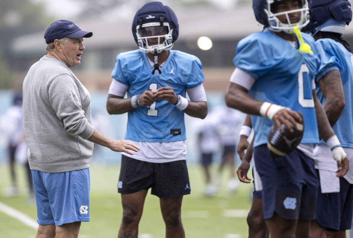 North Carolina head coach Bill Belichick talks with his wide receivers during the Tar Heels’ first day of practice for the 2025 season on Saturday, August 2, 2025 in Chapel Hill, N.C.