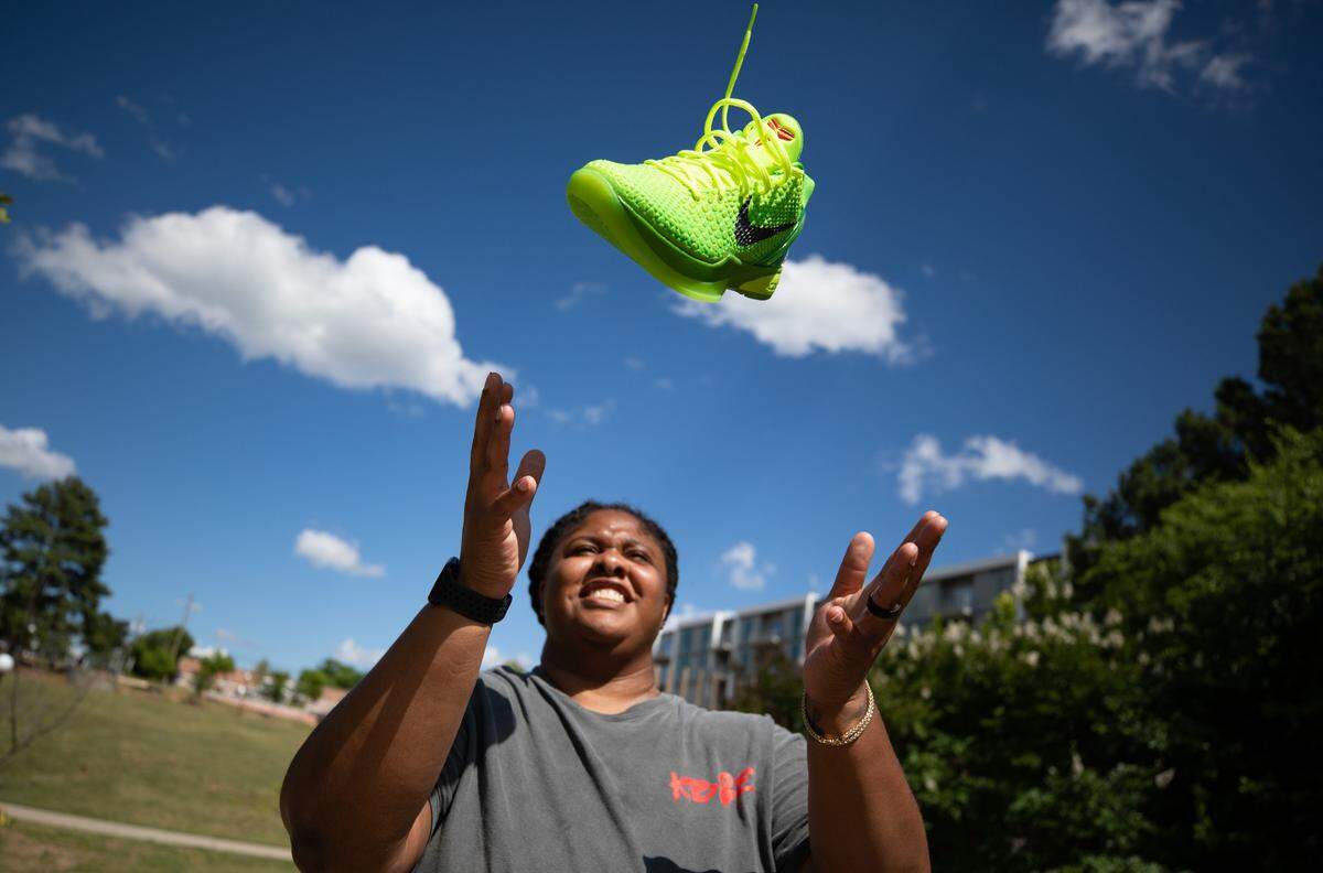 Kala Nwachukwu poses for a portrait at Durham Central Park in Durham, N.C. on Monday, June 12, 2023. Nwachukwu has over 150 pairs of sneakers in her closet, a passion which in 2014 led her to start The Kick Back Sneaker Expo. The biannual event, which will take place at the Raleigh Convention Center this weekend, drew 4,000 attendees last year.