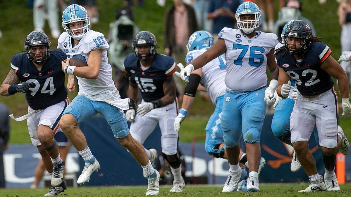North Carolina quarterback Drake Maye (10) breaks open for a 21-yard gain in the third quarter on Saturday, November 5, 2022 at Scott Stadium in Charlottesville, Va. Maye rushed for 74 yards in the Tar Heels’ victory.