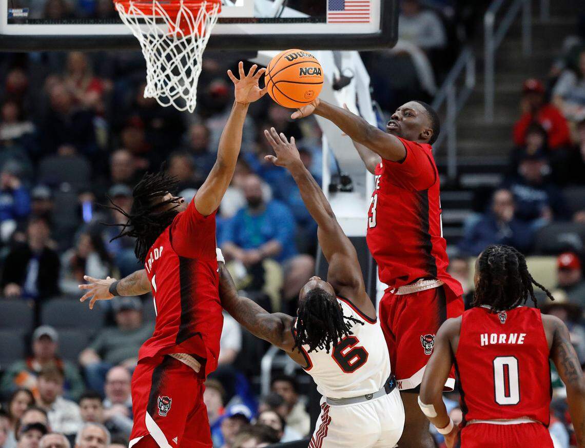 N.C. State’s Jayden Taylor and Mohamed Diarra pressure Texas Tech’s Joe Toussaint during the first half of the Wolfpack’s 80-67 win in the first round of the NCAA Tournament on Thursday, March 21, 2024, at PPG Paints Arena in Pittsburgh, Pa.