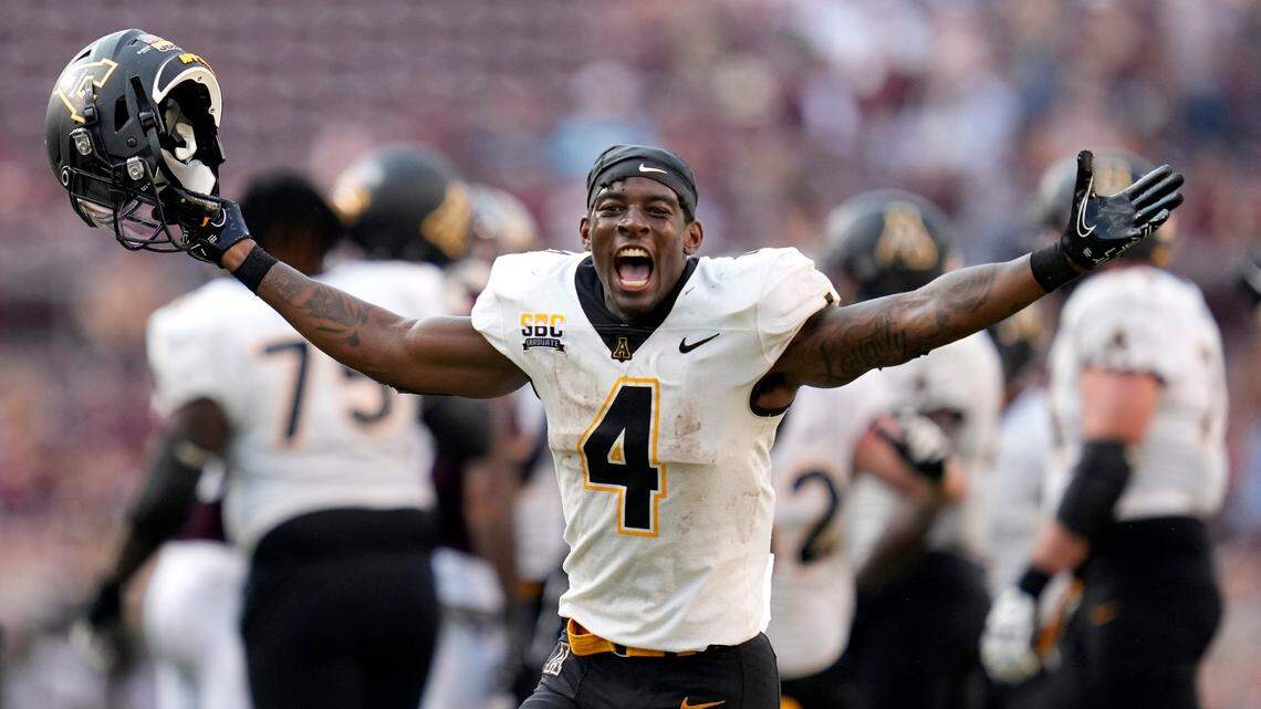 Appalachian State running back Daetrich Harrington (4) reacts as time expires after upsetting No. 6 Texas A&M in an NCAA college football game Saturday, Sept. 10, 2022, in College Station, Texas.