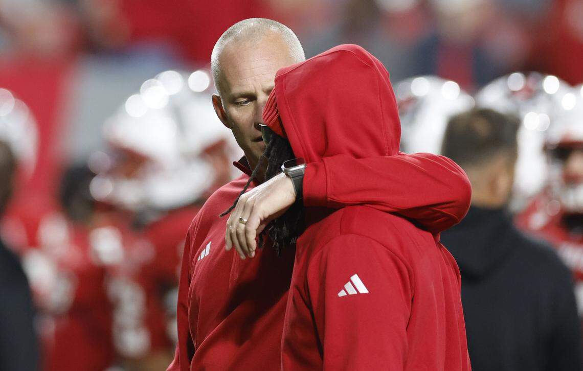 N.C. State head coach Dave Doeren talks to running back Hollywood Smothers (3) before N.C. State’s game against Georgia Tech at Carter-Finley Stadium in Raleigh, N.C., Saturday, Nov. 1, 2025.
