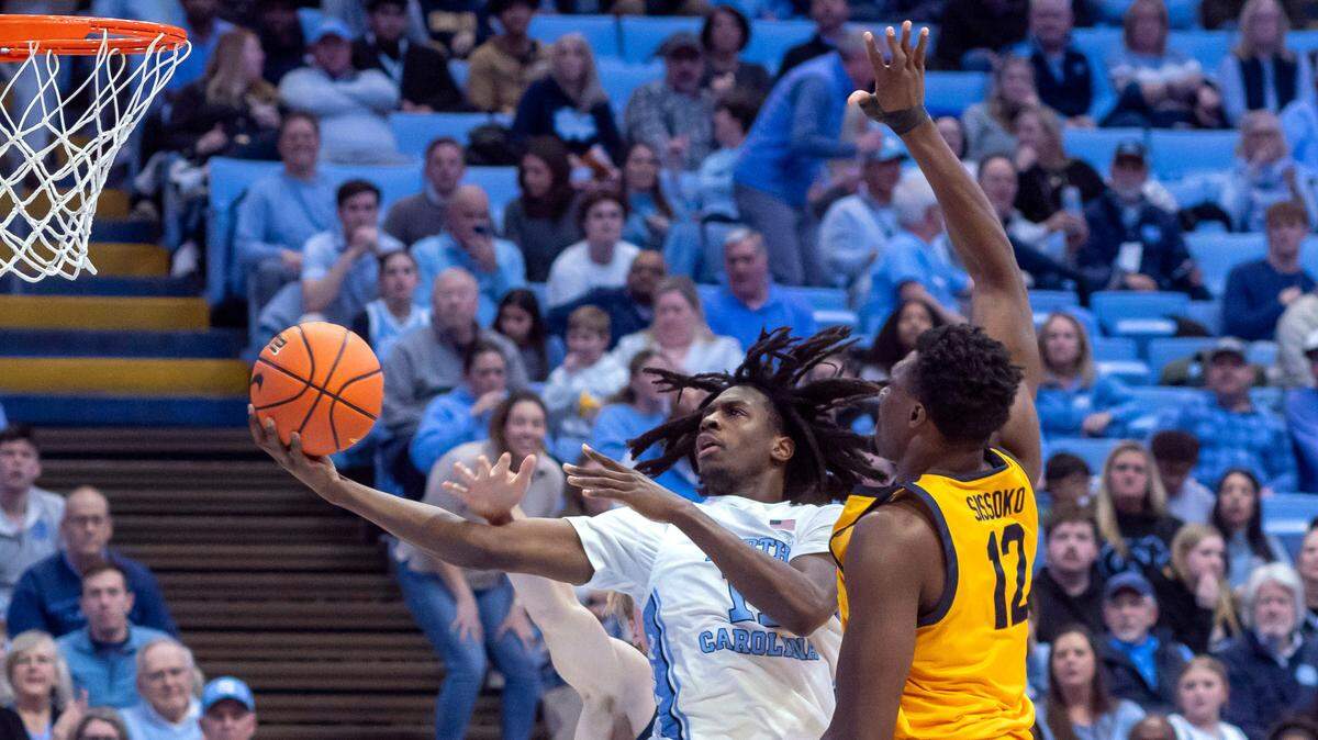 North Carolina guard Ian Jackson (11) drives to the basket against Mady Sissoko (12) in the second half on Wednesday, January 15, 2025 at the Smith Center in Chapel Hill, N.C. Jackson lead all scores with 20 points in the Tar Heels’ 79-53 victory.