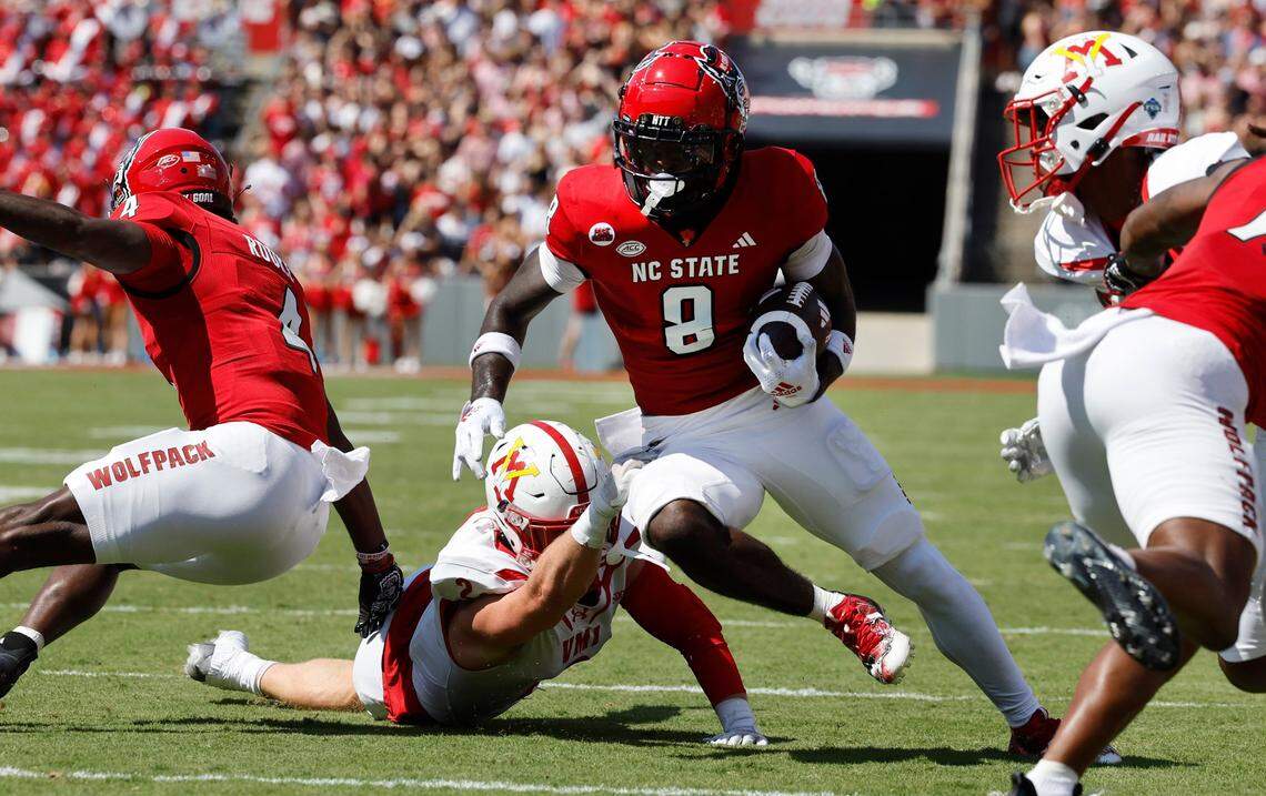 N.C. State wide receiver Julian Gray (8) gains yards after making the reception during the first half of N.C. State’s game against VMI at Carter-Finley Stadium in Raleigh, N.C., Saturday, Sept. 16, 2023.