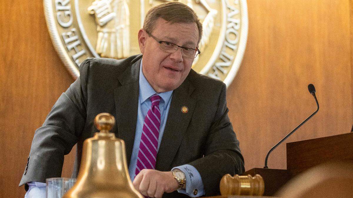 House Speaker Tim Moore talks with colleagues after passing the state budget following the House session on on Wednesday, November 17, 2021 in Raleigh, N.C.