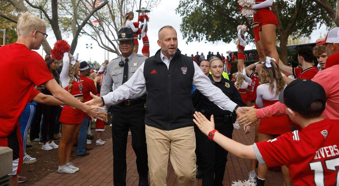 N.C. State head coach Dave Doeren greets fans during the Walk of Champions before N.C. State’s game against Boston College at Carter-Finley Stadium in Raleigh, N.C., Saturday, Nov. 12, 2022.