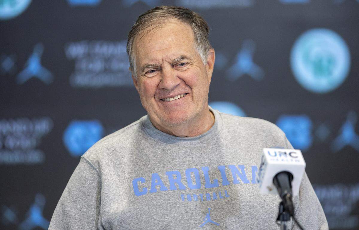 North Carolina coach Bill Belichick cracks a smile as he fields questions during a press conference prior to the Tar Heels’ first practice of the season on Saturday, August 2, 2025 in Chapel Hill, N.C.