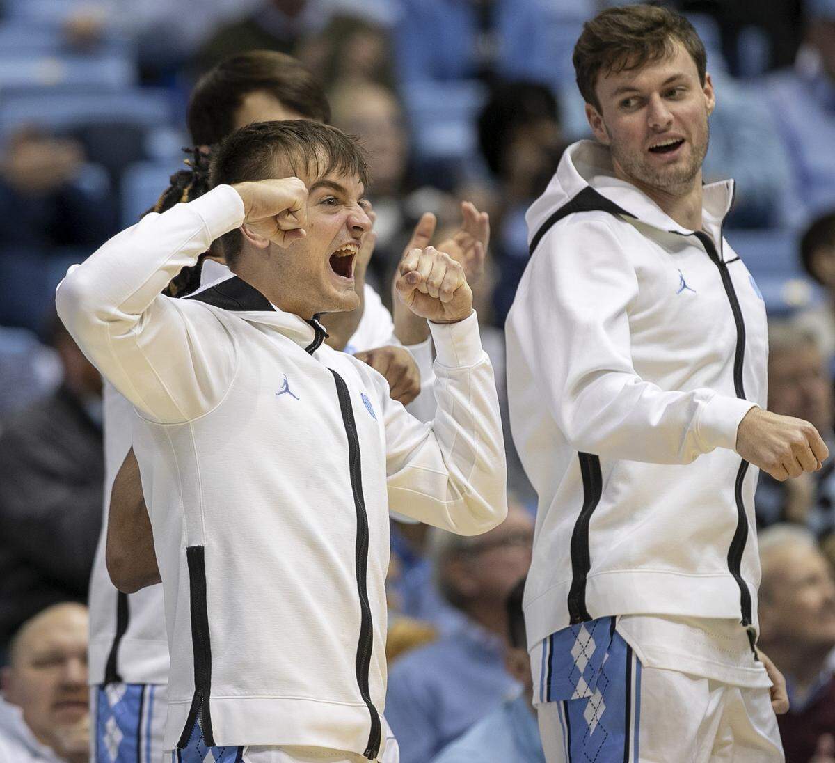 North Carolina’s Jackson Watkins (30) and Duwe Farris (34) react after a basket by Tyler Nickel (24) in the second half against The Citadel on Tuesday, December 13, 2022 at the Smith Center in Chapel Hill, N.C. 
