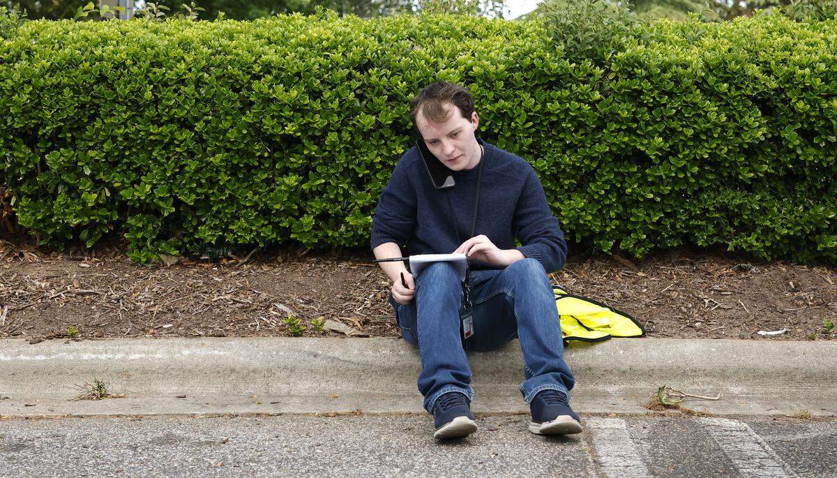 Nolan Wilkinson, a reporter at The News & Observer, reporting from a breaking news scene at Triangle Town Center on April 17, 2026.