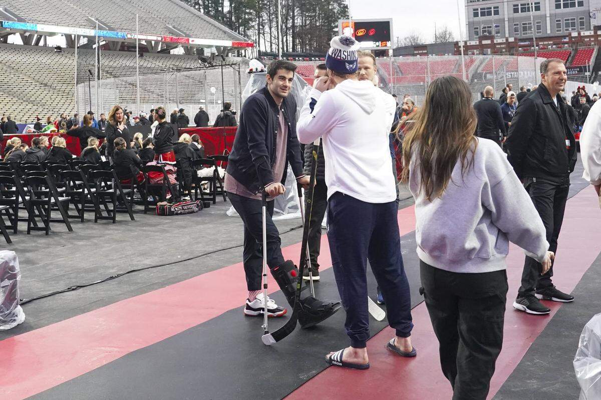 Feb 17, 2023; Raleigh, North Carolina, USA; Carolina Hurricanes left wing Max Pacioretty (67) talks to Washington Capitals center Nicklas Backstrom (19) and center Lars Eller (20)at Carter-Finley Stadium. Mandatory Credit: James Guillory-USA TODAY Sports