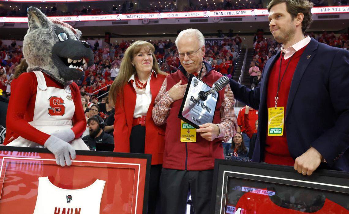 Gary Hahn acknowledges the crowd as he is recognized during the first half of N.C. State’s game against Duke at PNC Arena in Raleigh, N.C., Monday, March 4, 2024.