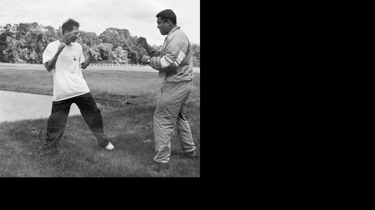  Muhammad Ali and Davis Miller, left, in 1992. The opera “Approaching Ali,” is about the relationship that Miller developed with Ali. 
