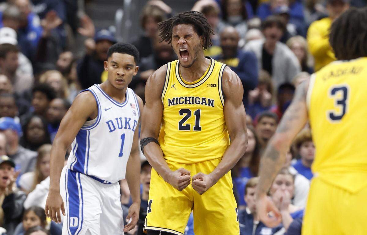 Michigan's Morez Johnson Jr. (21) celebrates after slamming in two during the first half of Duke’s game against Michigan in the Capital Showcase at Capital One Arena in Washington, D.C., Saturday, Feb. 21, 2026.