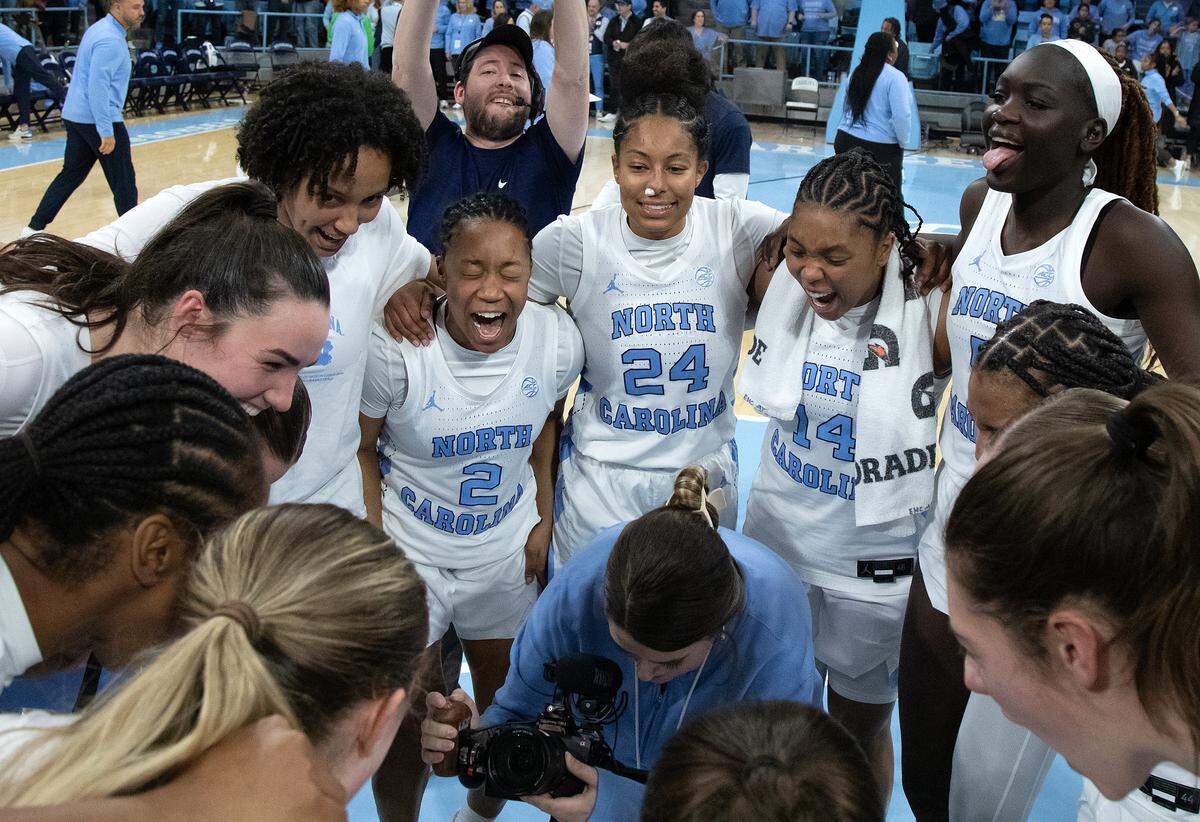 North Carolina celebrates in the huddle following their 53-46 overtime win over Duke on Thursday, Jan. 9, 2025, at Carmichael Arena in Chapel Hill, N.C.