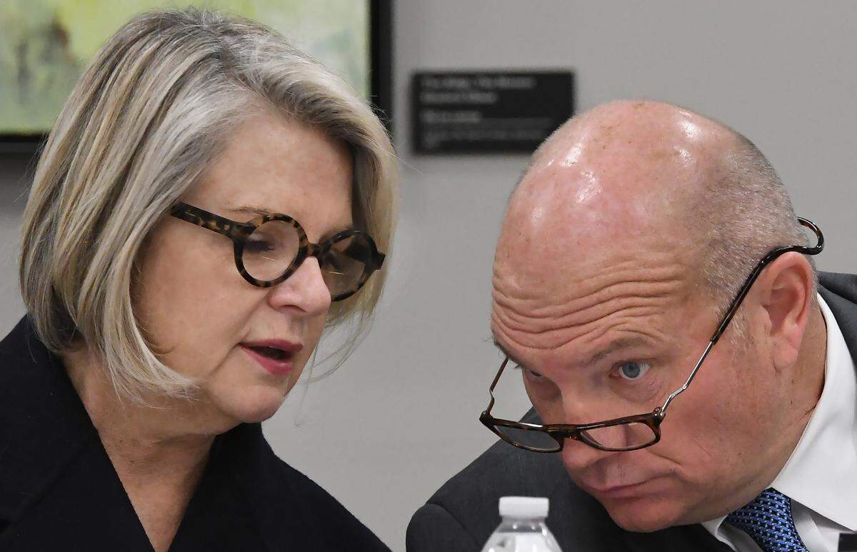 UNC President Margaret Spellings is pictured speaking with at the UNC Board of Governors chairman Harry Smith at the beginning of an emergency session the board called Friday, October 26, 2018 in Chapel Hill, N.C. The board was meeting to discuss her departure package during a closed session