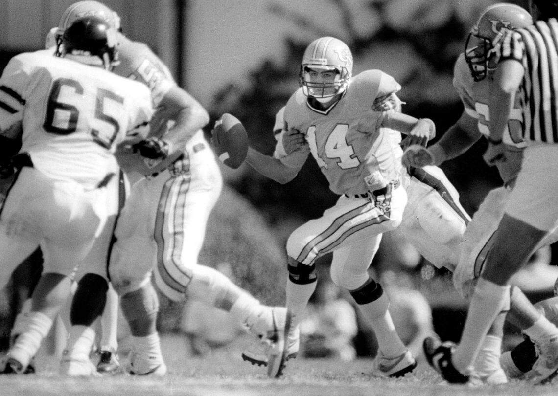 North Carolina quarterback Mark Maye (14) runs the ball against Wake Forest on October 10, 1987 at Kenan Stadium in Chapel Hill, N.C.