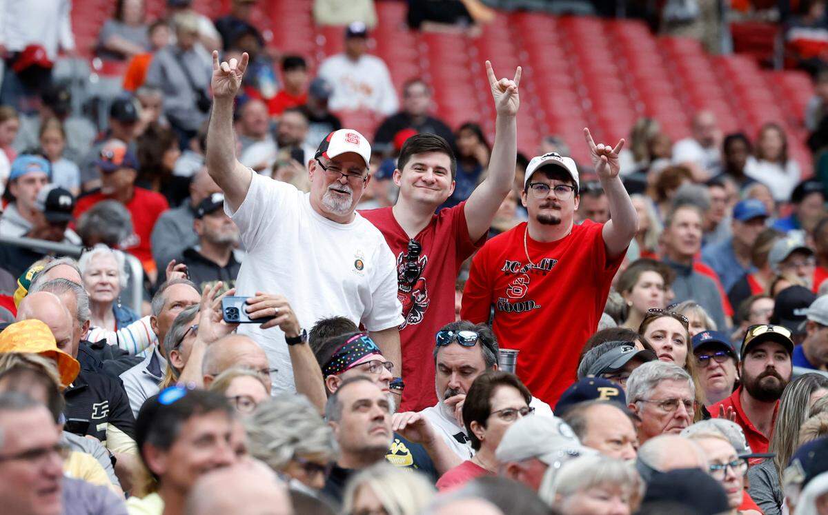 Wolfpack fans cheer on N.C. State during their practice at State Farm Stadium in Glendale, Ariz., Friday, April 5, 2024. The Wolfpack will face Purdue in the NCAA Tournament national semifinals Saturday.