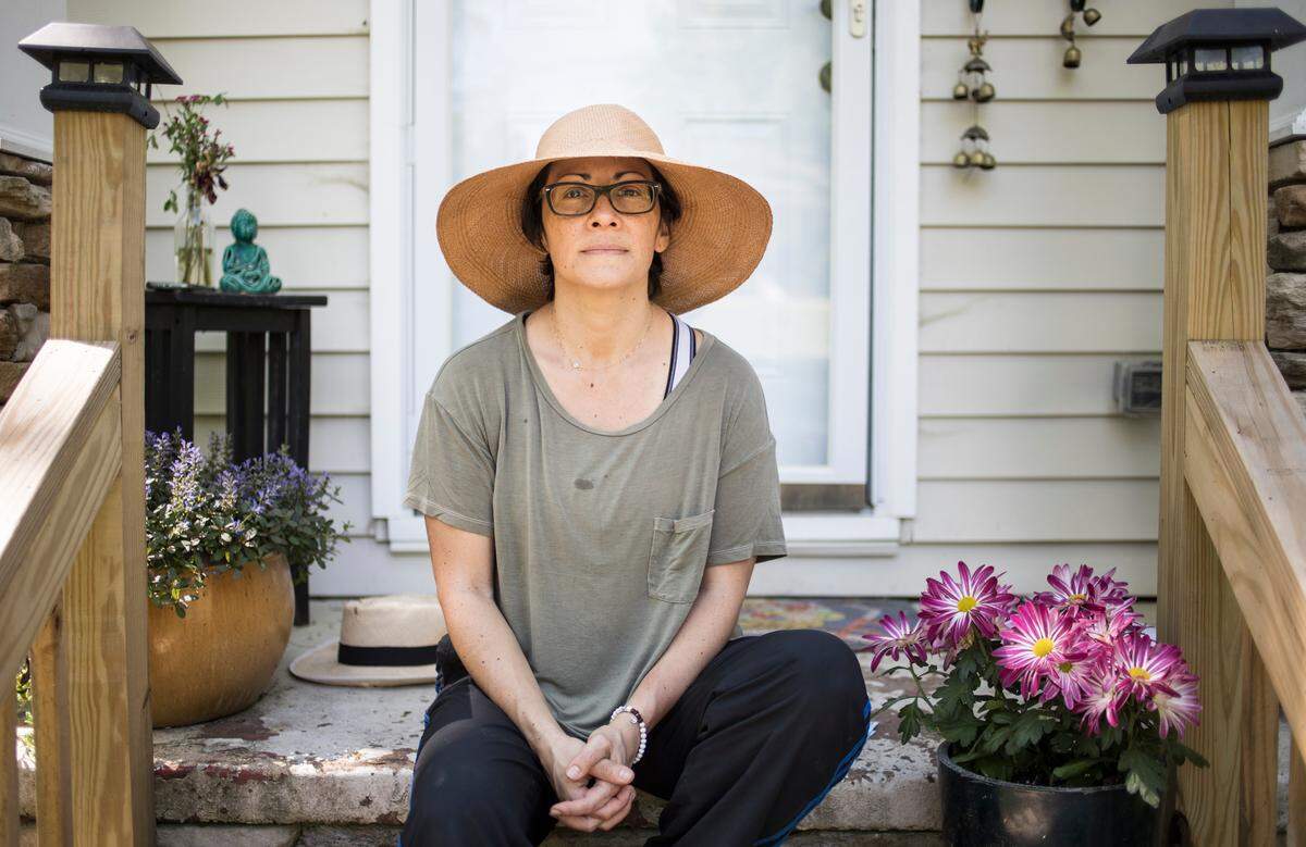 Angela Salamanca, owner of Centro, a restaurant in downtown Raleigh, N.C., poses for a portrait outside her home after gardening with her daughter on Wednesday, April 8, 2020. Salamanca has struggled to start the process of approving unemployment benefits for her laid off workers as the deluge of applications flood and crash the state’s website. “I go back and forth between despair and frustration,” she said. “No aid has come yet. The uncertainty of it all is really scary.”