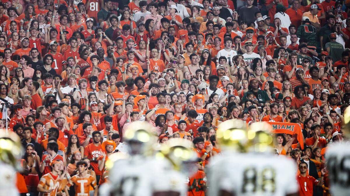 Miami fans celebrate during the Hurricanes’ win over the Notre Dame Fighting Irish on August 31, 2025 in Miami Gardens, Florida.