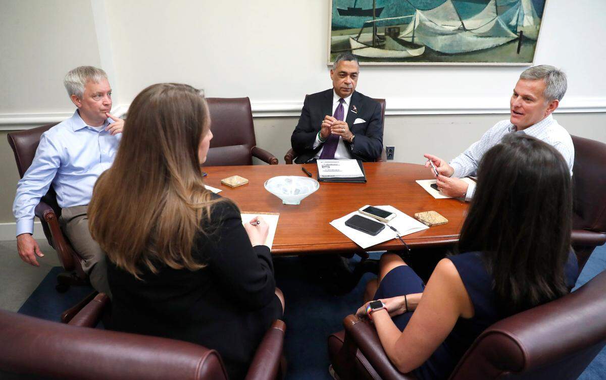 North Carolina Attorney General Josh Stein, right, meets to discuss legal strategies with, clockwise from Stein, deputy chief of staff Laura Brewer, criminal bureau chief Leslie Cooley Dismukes, general counsel Swain Wood and civil bureau chief Reuben Young, Thursday, July 29, 2021, in Raleigh, N.C.