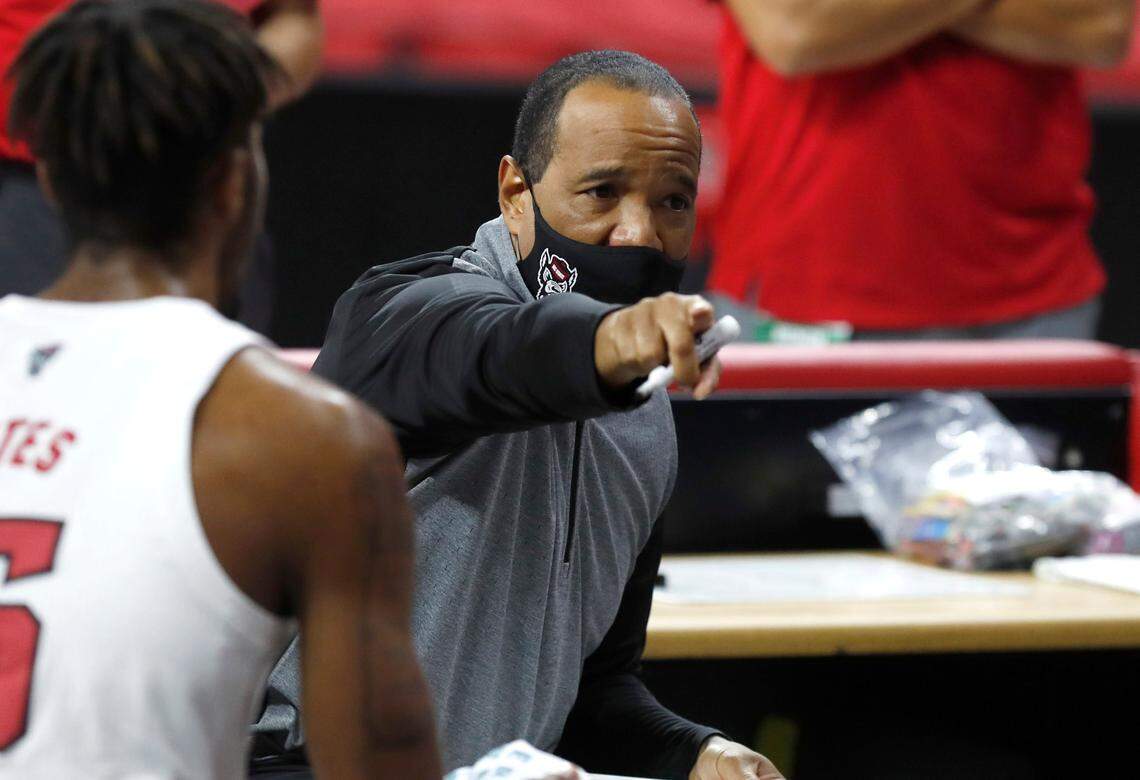 N.C. State’s head coach Kevin Keatts talks with his team during a timeout during the first half of N.C. State’s game against Campbell at PNC Arena in Raleigh, N.C., Saturday, Dec. 19, 2020.