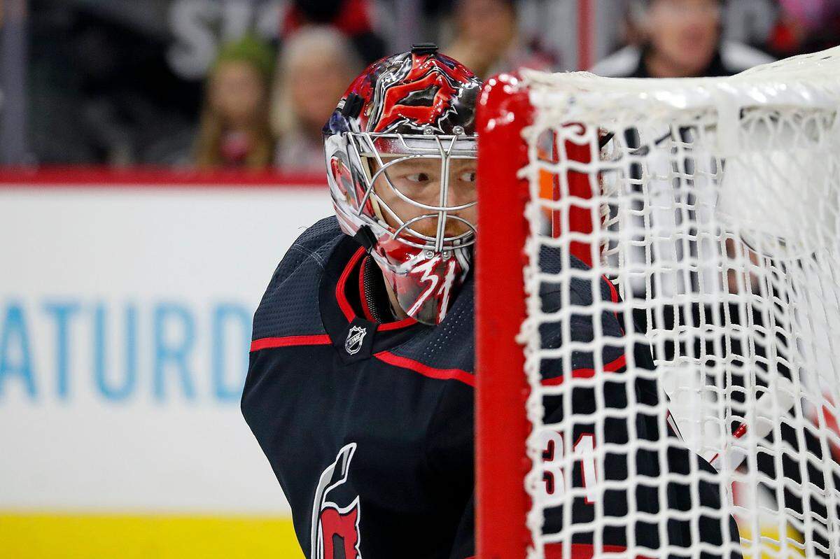 Carolina Hurricanes goaltender Frederik Andersen (31) watches the puck behind the net during the first period of an NHL hockey game against the Los Angeles Kings in Raleigh, N.C., Saturday, Dec. 18, 2021. (AP Photo/Karl B DeBlaker)