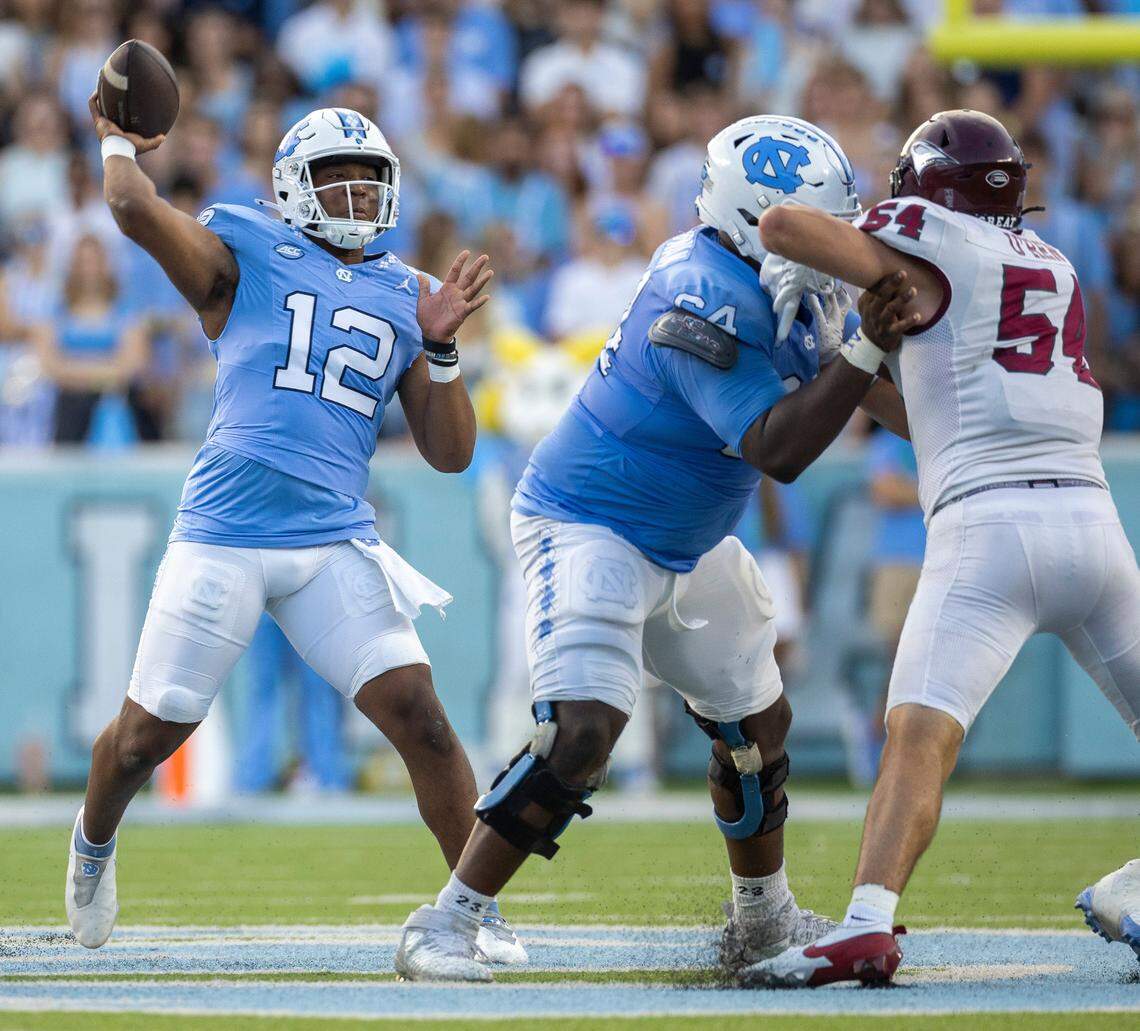 North Carolina quarterback Jacolby Criswell (12) looks for a receiver in the second quarter against N.C. Central on Saturday, September 14, 2024 at Kenan Stadium in Chapel Hill, N.C. Criswell was put into the game replacing starter Conner Harrell. Criswell passed for 161 yards and one touchdown.