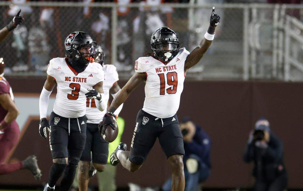 N.C. State safety Bishop Fitzgerald (19) celebrates after intercepting the ball during the second half of N.C. State’s 35-28 victory over Virginia Tech at Lane Stadium in Blacksburg, VA, Saturday, Nov. 18, 2023.