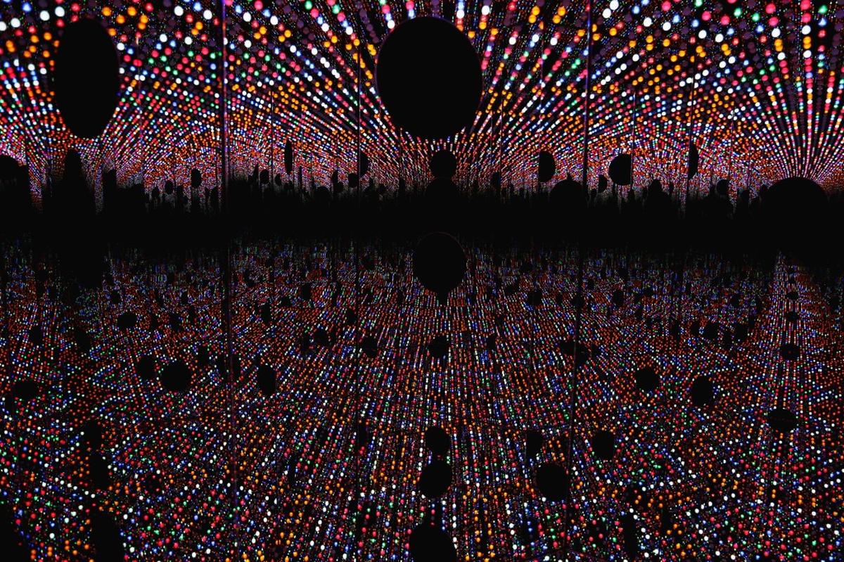 An inside view of North Carolina Museum of Art's newest acquisition, Yayoi Kusama's "Light of Life" on Monday, March 26, 2018. From the outside, the piece looks like a mirrored hexagonal box but stick your head inside one of its three portholes, and you'll see yourself transported into an enclosed "infinity room" of changing colors and patterns.