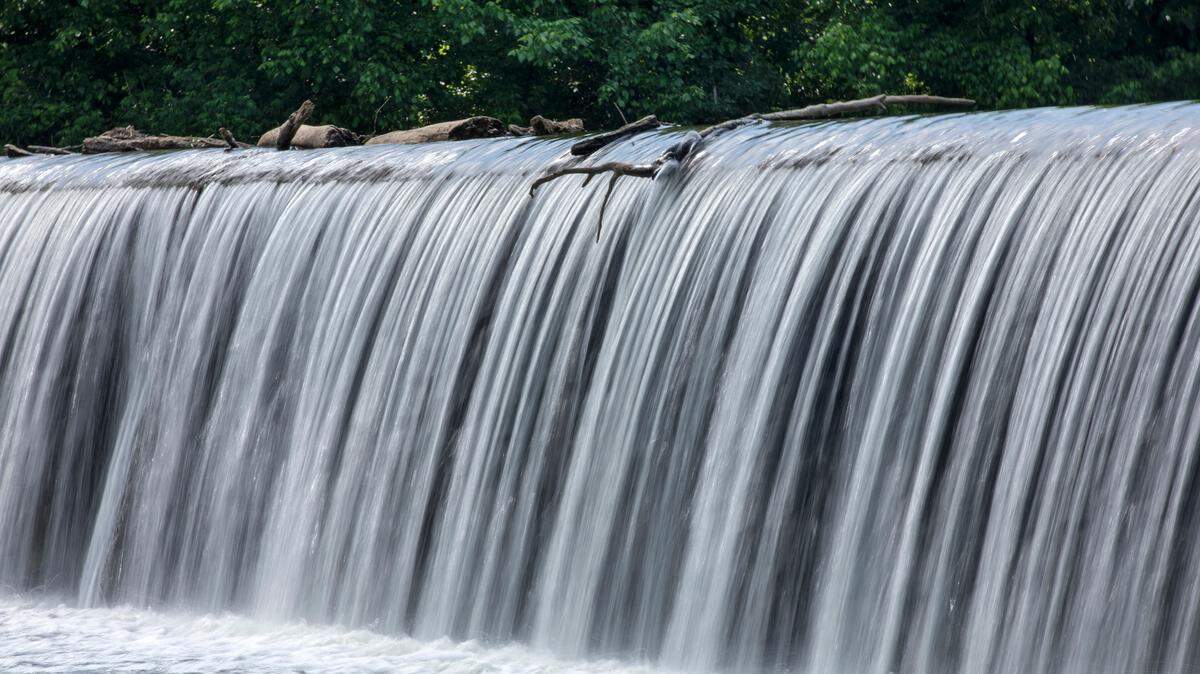 The Haw River, shown here flowing over a dam in Bynum, struggles with contamination from both 1,4-dioxane and PFAS. The state’s Environmental Management Comission has stalled action on both chemicals, frustrating environmental advocates and state regulators.