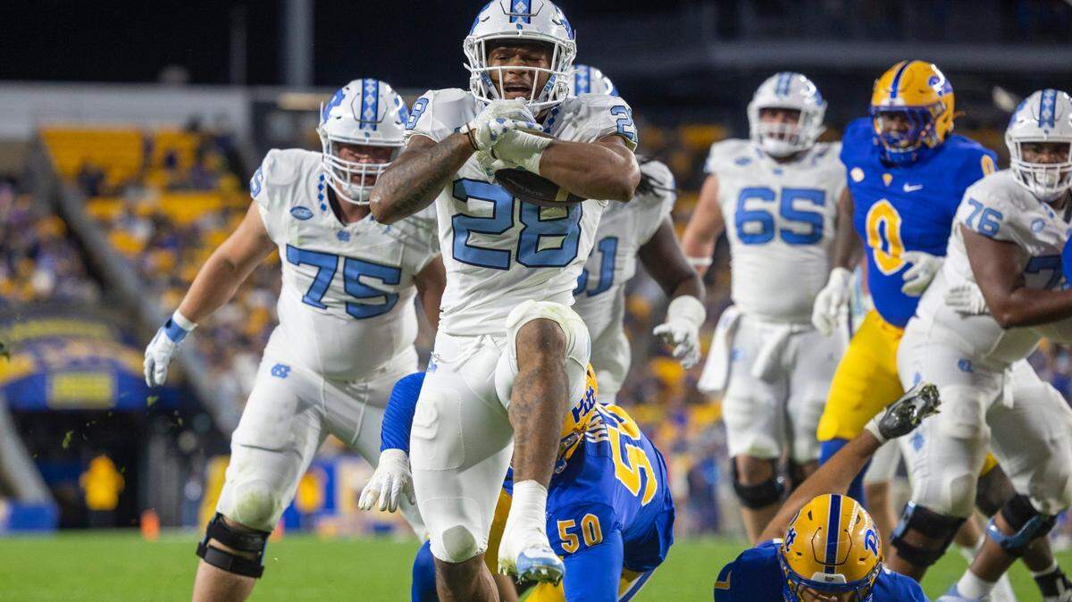 North Carolina running back Omarion Hampton (28) scores on three-yard run to tie Pitt 7-7 in the first quarter on Saturday, September 23, 2023 at Acrisure Stadium in Pittsburgh, Pa.