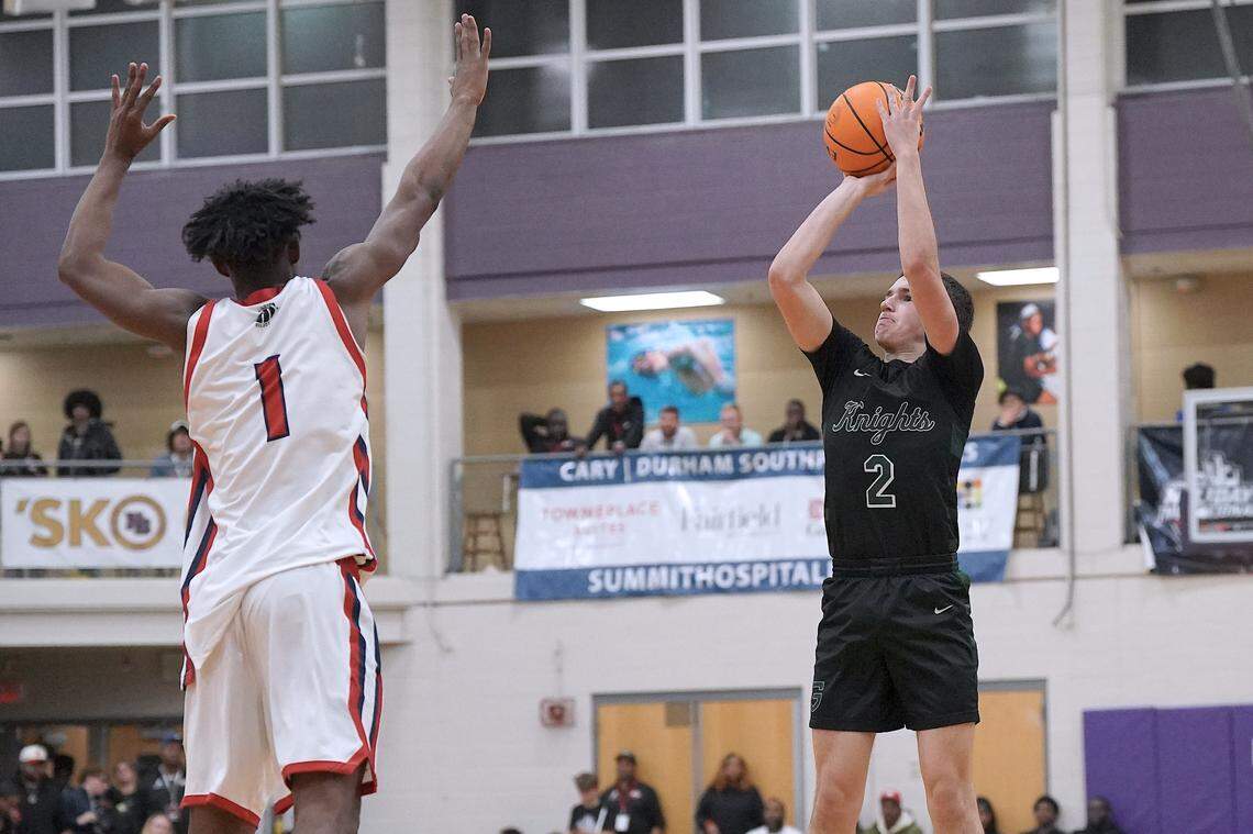 Greenfield's Johnny Winborne (2) pulls up for the three-point shot over Coronado's Munir Greig (1) during the second half. The Greenfield Knights and the Coronado Cougars (Nevada) met in the finals of the Day'Ron Sharpe bracket of the  John Wall Holiday Tournament in Raleigh, N.C. on December 30, 2025.
