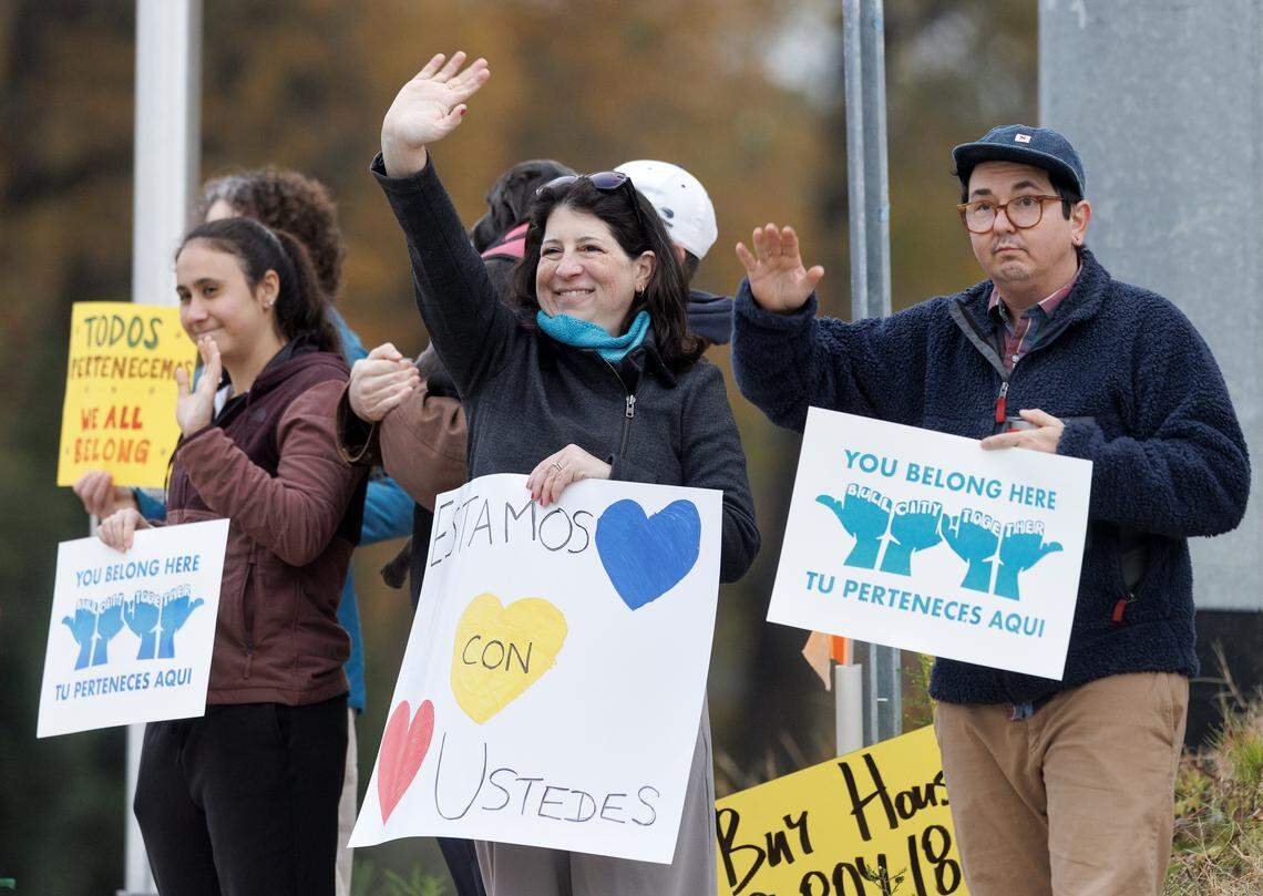 People gather as a part of a “School-Based Care and Protection Team,” organized through Durham Public School Strong, Durham For All and other groups, to show support for students on Thursday, Nov. 20, 2025, in Durham, N.C.