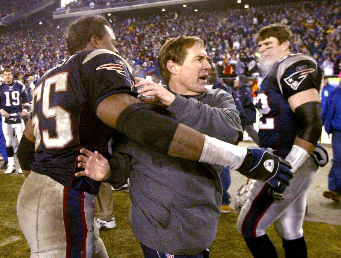 New England Patriots head coach Bill Belichick celebrates with linebacker Willie McGinest after defeating the Indianapolis Colts, 24-14, in the AFC championship game at Gillette Stadium in Jan. 2004.