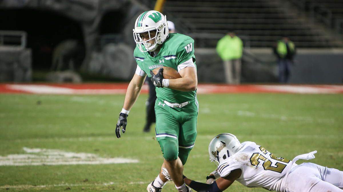 Weddington’s Will Shipley breaks a tackle during the first half of the NCHSAA 3AA championship game on Saturday at Carter-Finley Stadium. Shipley finished with 256 yards rushing and four touchdowns.