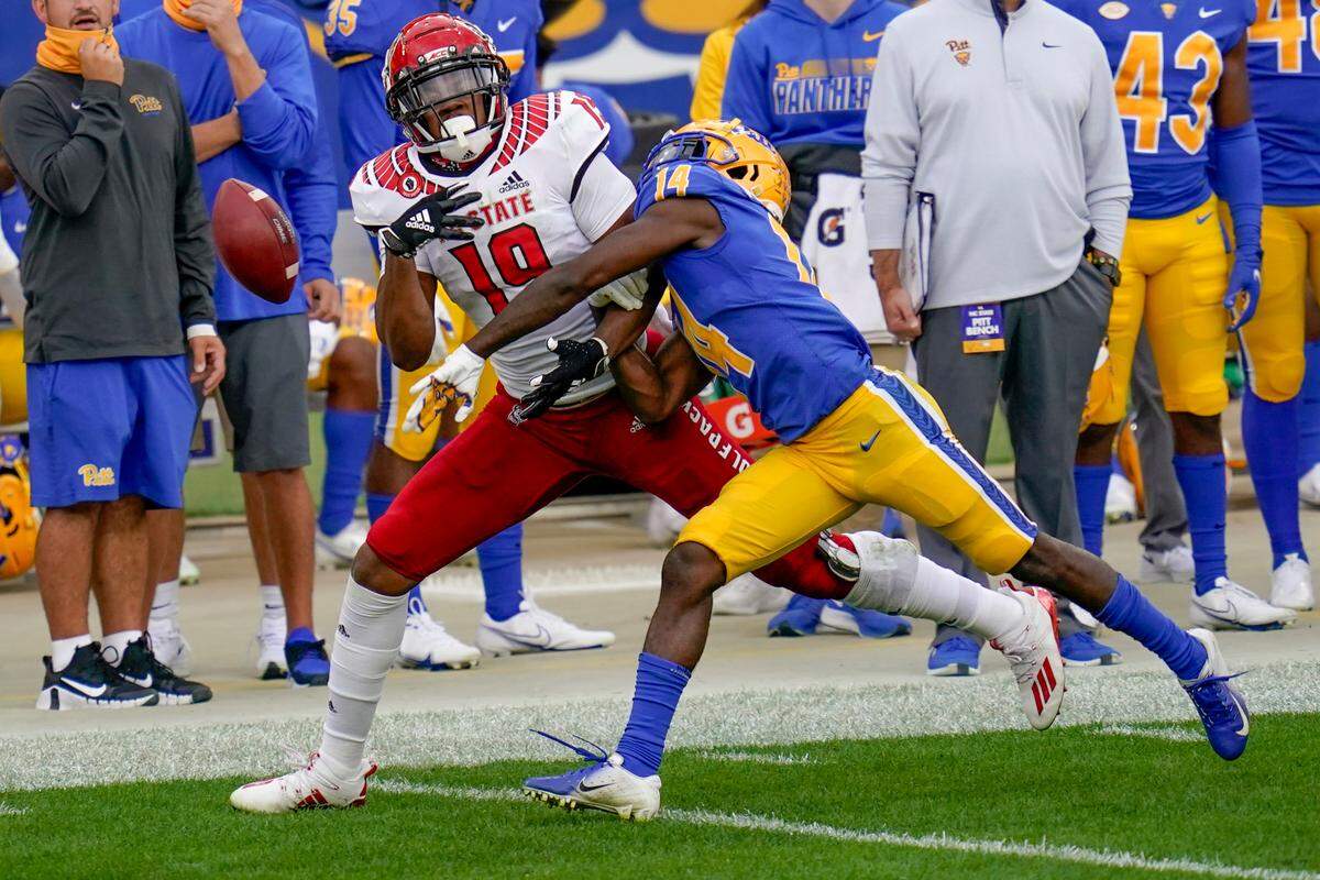 Pittsburgh Panthers defensive back Marquis Williams (14) deflects a pass to North Carolina State wide receiver C.J. Riley (19) during an NCAA college football game, Saturday, Oct. 3, 2020, in Pittsburgh.