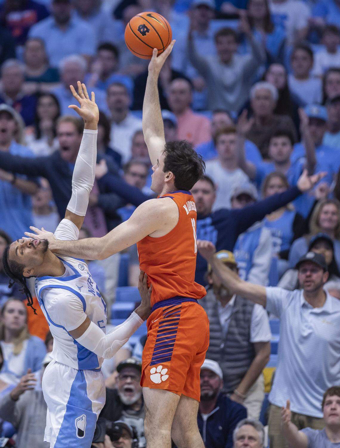 Clemson center Nick Davidson (11) fouls North Carolina forward Jarin Stevenson (15) as he drives to the basket in the second half on Tuesday, March 3, 2026 at the Smith Center in Chapel Hill, N.C.