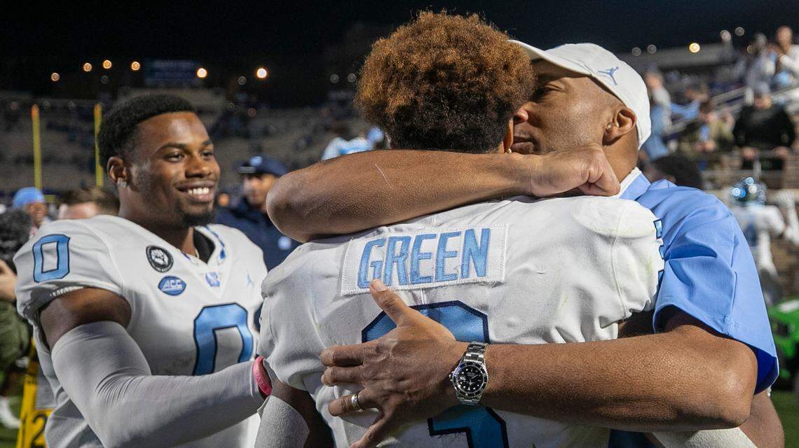 North Carolina wide receivers coach Lonnie Galloway embraces Antoine Green (3) following the Tar Heels 38-35 victory over Duke on Saturday, October 15, 2022 at Wallace-Wade Stadium in Durham, N.C. Green scored the winning touchdown with 16 seconds to play.
