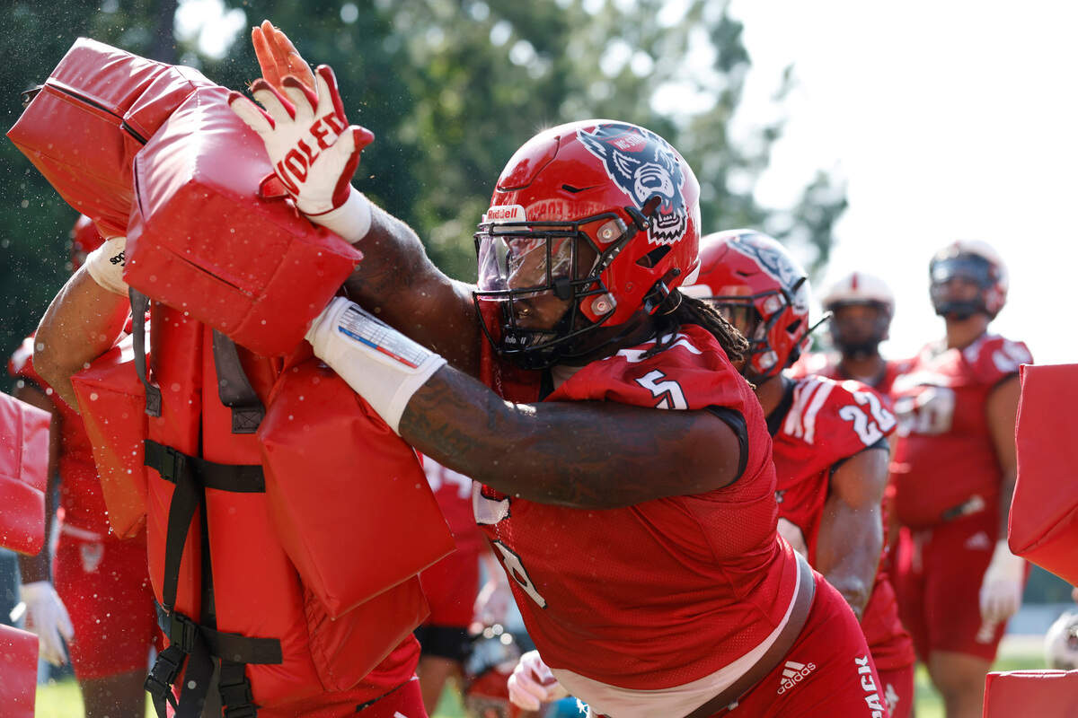 N.C. State defensive tackle C.J. Clark (5) runs drills during the Wolfpack’s first practice of fall camp in Raleigh, N.C., Wednesday, August 3, 2022.