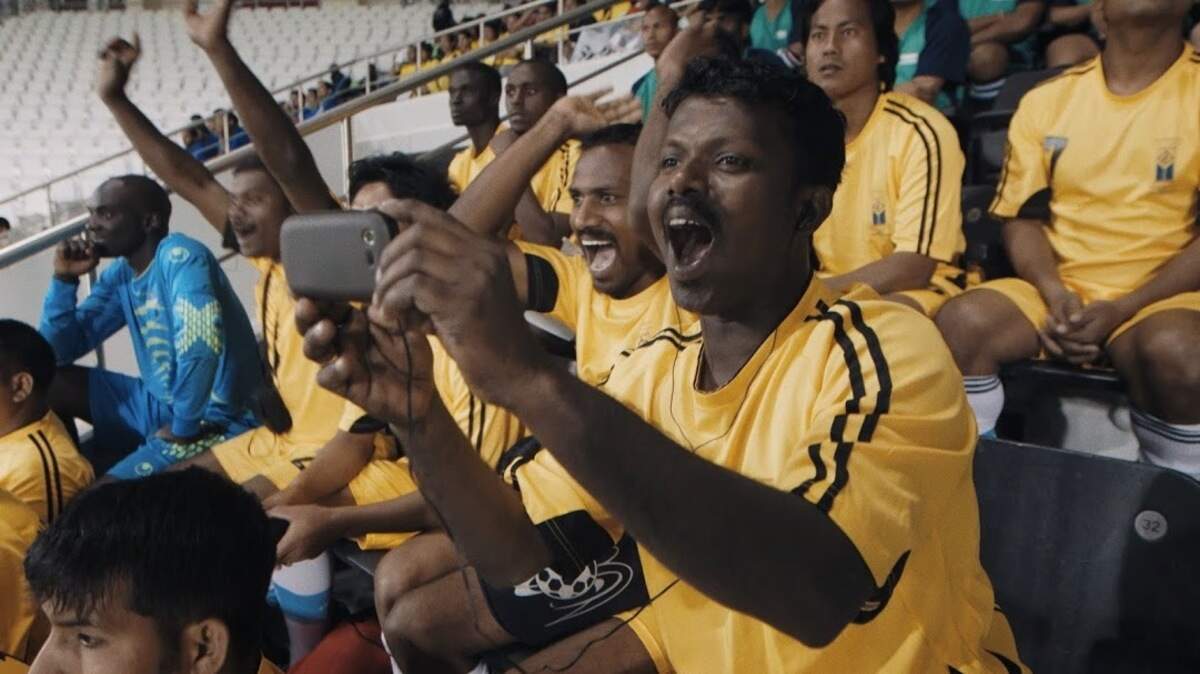 Umesh at Al Sadd stadium in Doha, Qatar, attends a game of the Qatar Stars League before his team's opening match in the POV documentary "The Workers Cup."