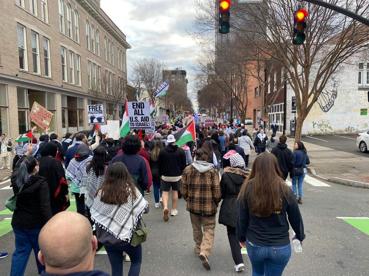 Protesters demanding a ceasefire in the Israel-Hamas war block traffic in downtown Raleigh, North Carolina, on Sunday, Jan. 28, 2024.